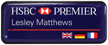 A prestige name badge brushed design with dark background with the leyend: "HSBC"